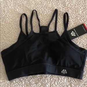 Women’s Large black mesh overlay sports bra.